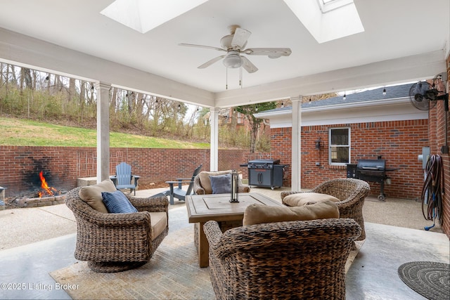 view of patio with outdoor lounge area, ceiling fan, and grilling area