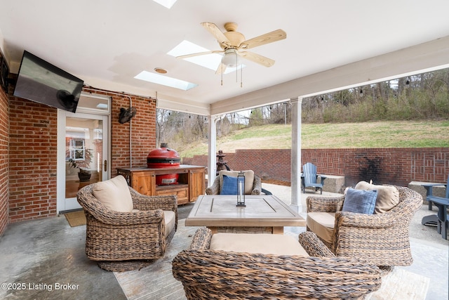 view of patio featuring an outdoor hangout area and a ceiling fan