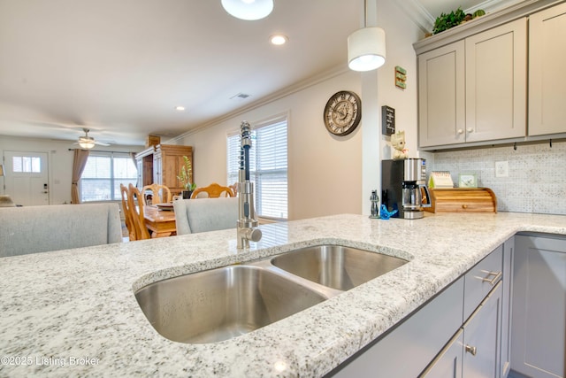 8105 Cedar Crest Ln, Louisville, KY 40291 - kitchen with gray cabinets, a sink, ornamental molding, decorative backsplash, and ceiling fan