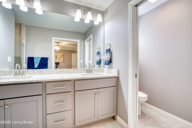 8105 Cedar Crest Ln, Louisville, KY 40291 - full bathroom with double vanity, tile patterned flooring, toilet, and baseboards