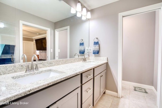 8105 Cedar Crest Ln, Louisville, KY 40291 - bathroom with double vanity, baseboards, and tile patterned floors