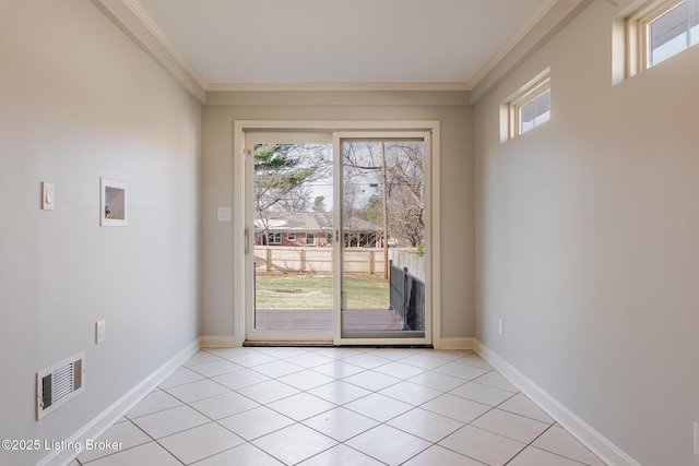 doorway to outside featuring ornamental molding, visible vents, baseboards, and light tile patterned floors