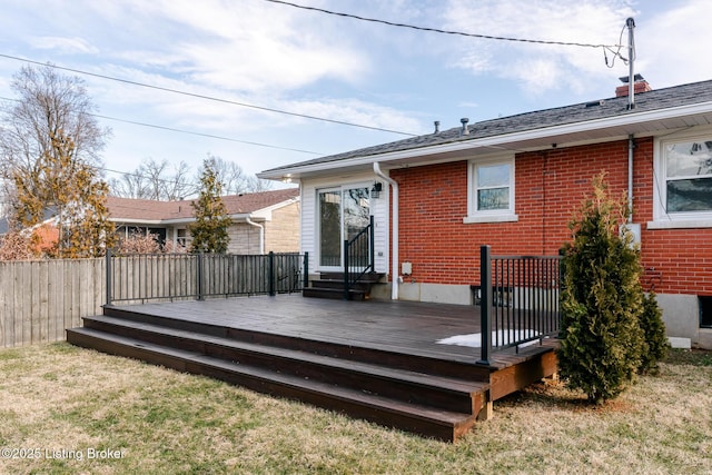 wooden deck with a yard and fence