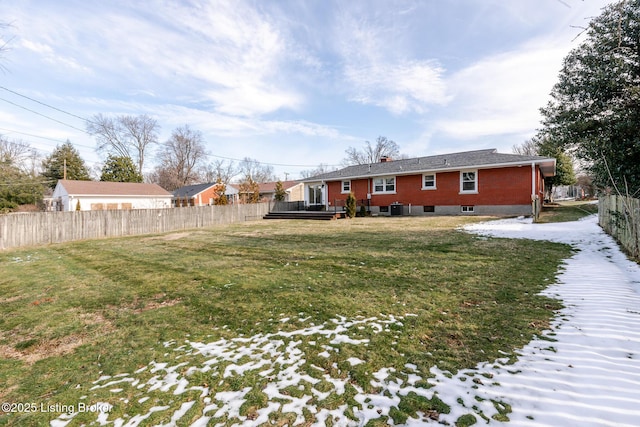 view of yard featuring cooling unit, fence, and a wooden deck