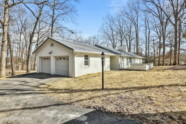 exterior space with aphalt driveway