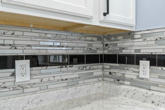 details with tasteful backsplash and white cabinets