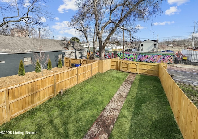 view of yard featuring a fenced backyard