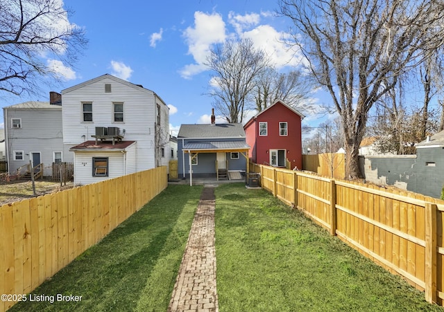 view of yard with a fenced backyard