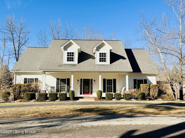 cape cod home with a porch