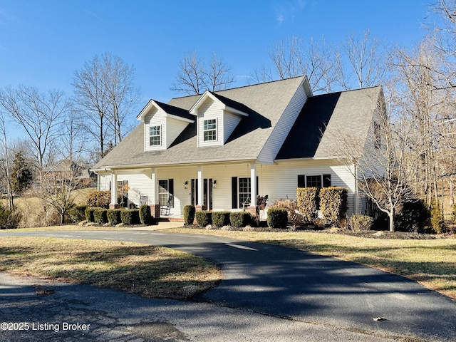 cape cod-style house with a porch