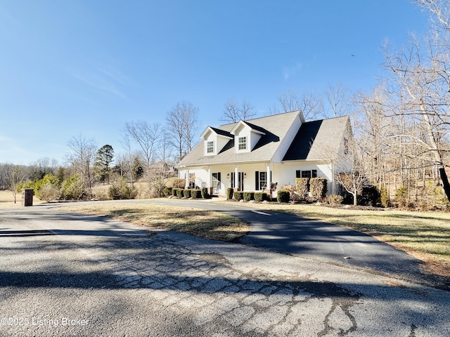 exterior space with covered porch and driveway