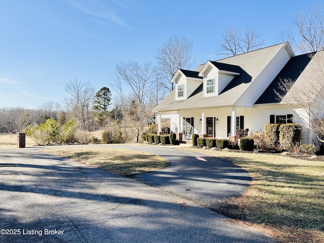 view of property exterior with a porch