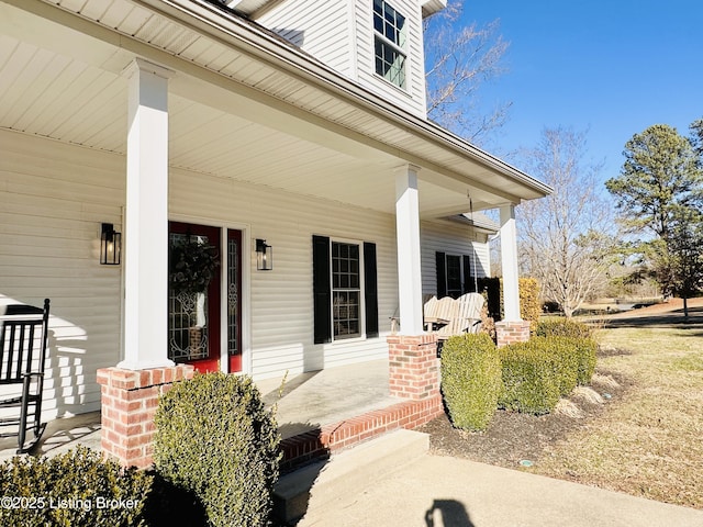 view of exterior entry with a porch