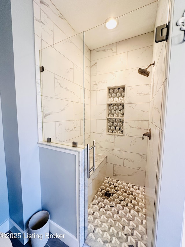 bathroom with a stall shower