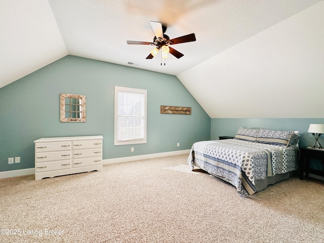 carpeted bedroom featuring a ceiling fan, lofted ceiling, visible vents, and baseboards