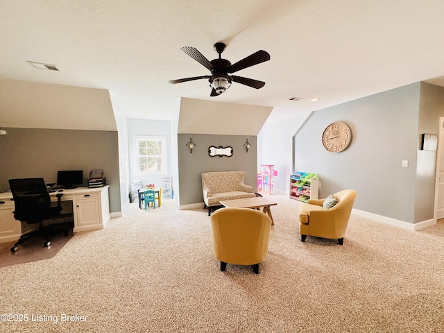 living area featuring visible vents, vaulted ceiling, a textured ceiling, and light colored carpet