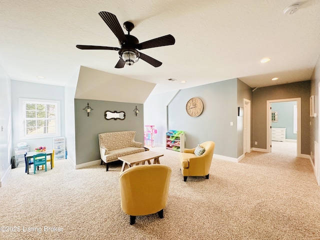 recreation room featuring light carpet, visible vents, and baseboards