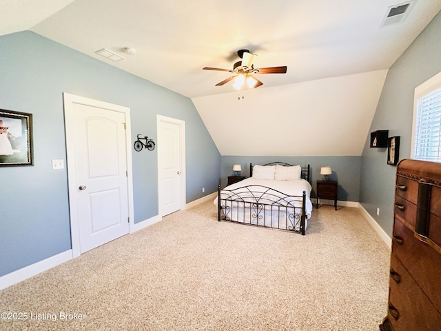 carpeted bedroom with a ceiling fan, lofted ceiling, visible vents, and baseboards