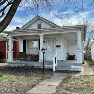 greek revival inspired property featuring covered porch