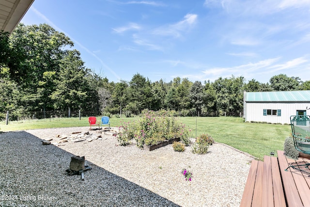 view of yard with a garden and fence