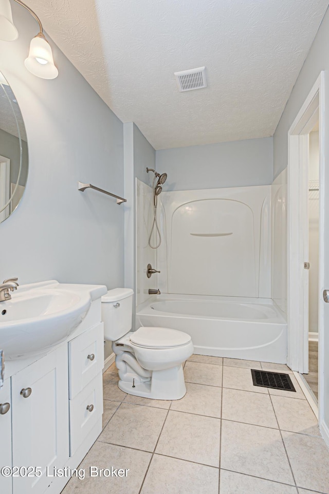 bathroom featuring visible vents, vanity, tile patterned floors, a textured ceiling, and shower / bathtub combination