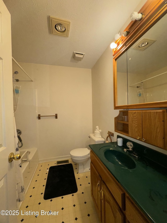 full bathroom with visible vents, a textured ceiling, toilet, and tub / shower combination