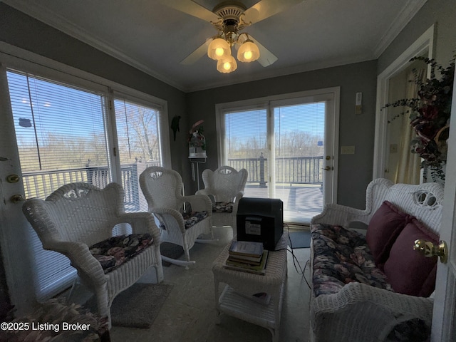 living area featuring carpet floors, a healthy amount of sunlight, and crown molding