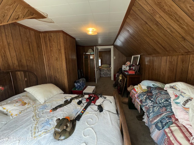 bedroom featuring lofted ceiling, carpet flooring, and wooden walls