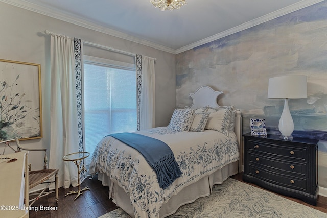 bedroom with wood finished floors and ornamental molding