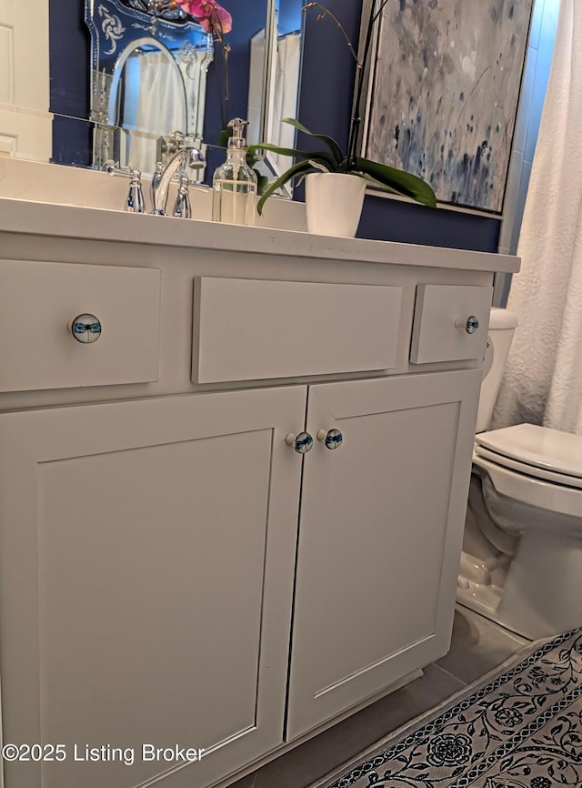 bathroom with vanity and toilet