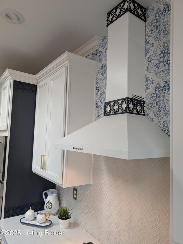 kitchen with light countertops and white cabinets