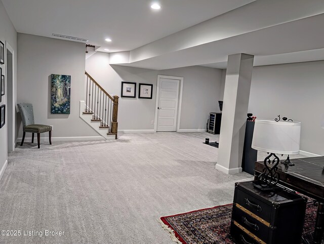 finished basement with stairs, recessed lighting, carpet, and baseboards