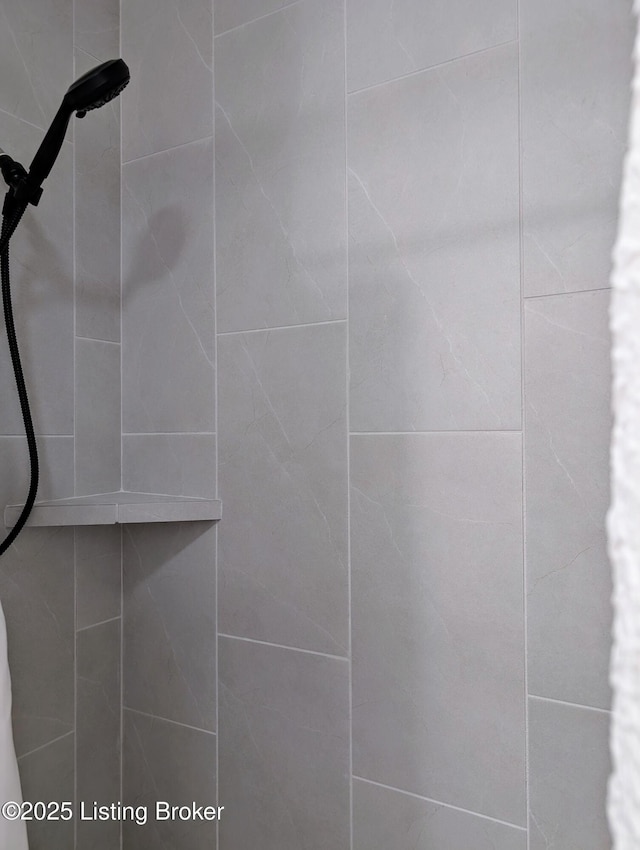 details with a tile shower