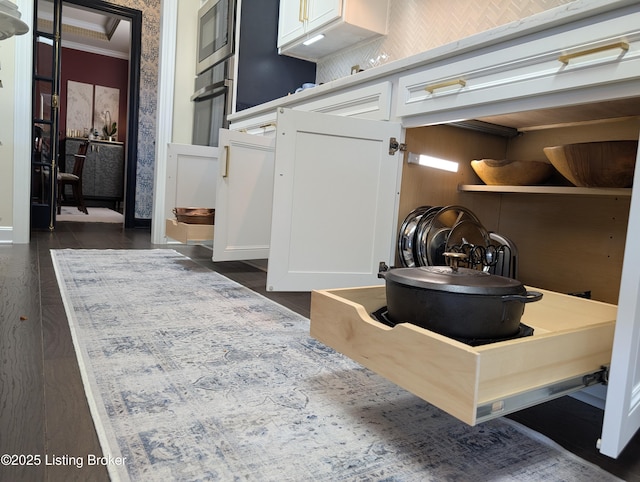 bathroom featuring wood finished floors and ornamental molding