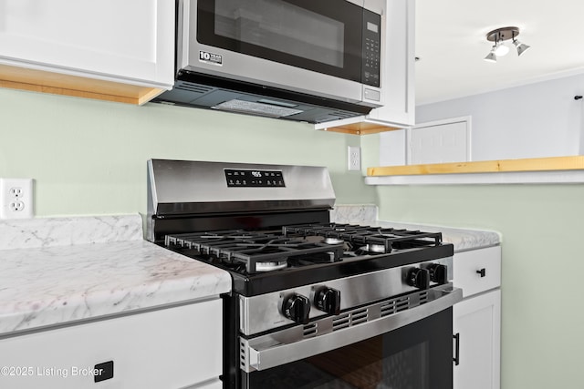 kitchen with white cabinets and stainless steel appliances