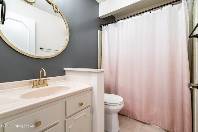 bathroom with a shower with shower curtain, vanity, toilet, and tile patterned floors