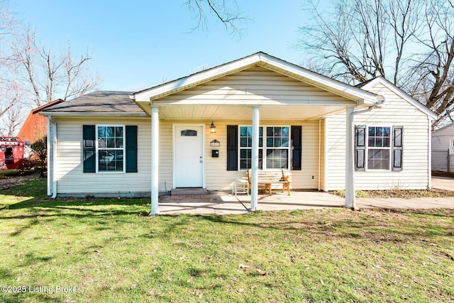 bungalow-style home with a front lawn