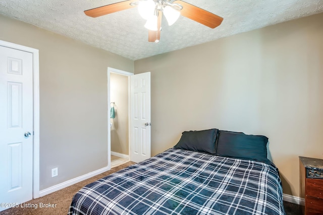 carpeted bedroom featuring a textured ceiling, ceiling fan, and baseboards