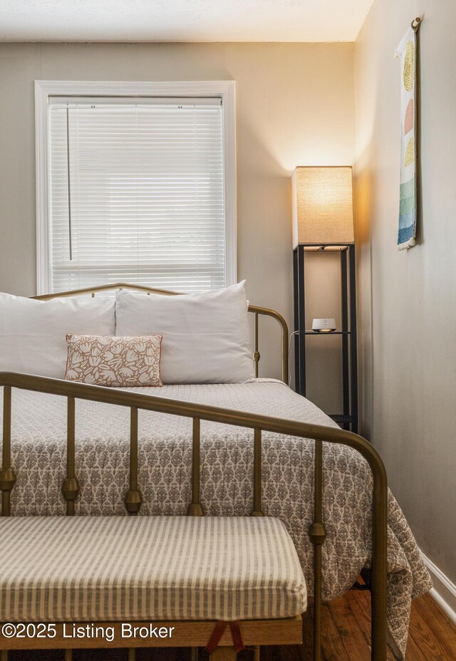 bedroom featuring wood finished floors