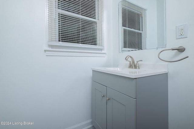 bathroom featuring vanity and baseboards