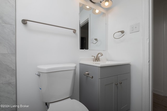 bathroom with vanity and toilet