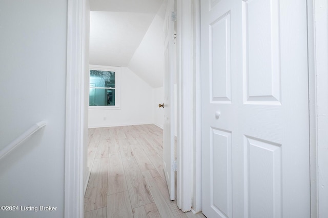 bonus room featuring lofted ceiling and wood finished floors