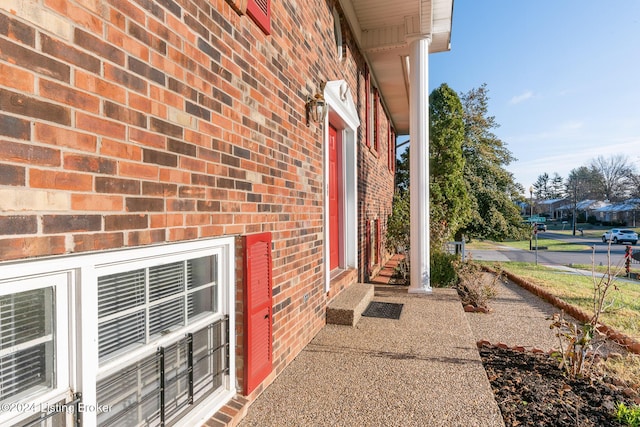 exterior space featuring brick siding