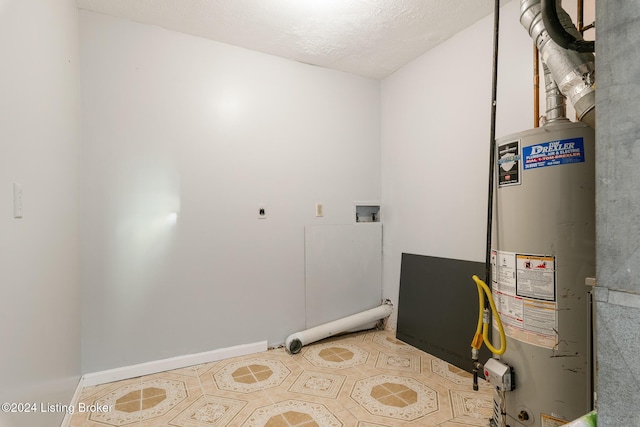 laundry room featuring gas water heater, hookup for a washing machine, tile patterned flooring, hookup for an electric dryer, and laundry area