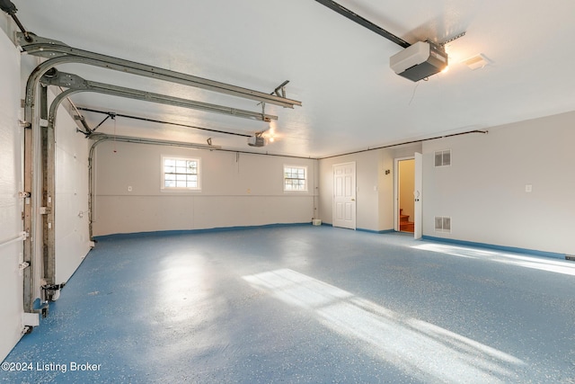 garage with visible vents and a garage door opener