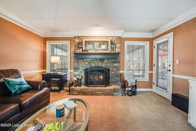 living room featuring ornamental molding, carpet flooring, and a stone fireplace