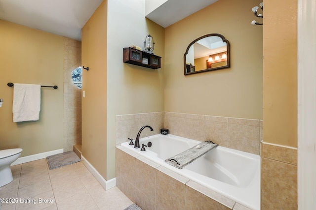 bathroom with tile patterned floors, toilet, a tile shower, baseboards, and a bath