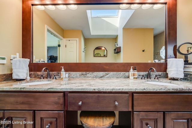 full bath featuring double vanity and a sink