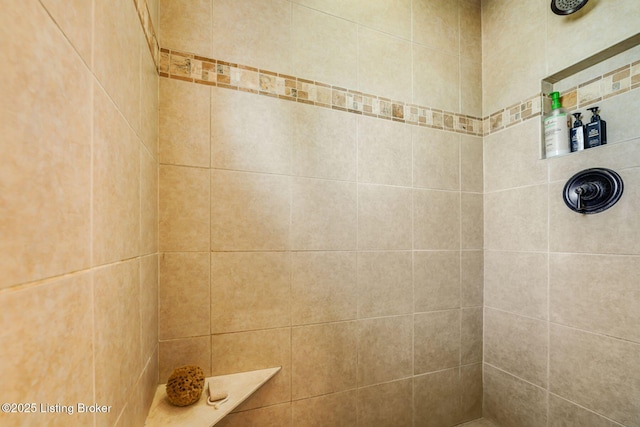 bathroom with tiled shower