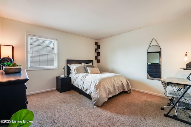 carpeted bedroom featuring baseboards